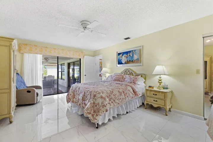 Primary Bedroom with Sliders to Family Room