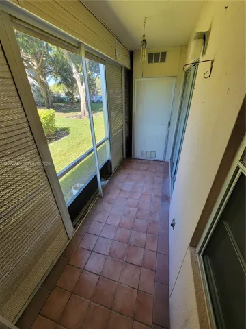Screened Balcony showing Storage Room