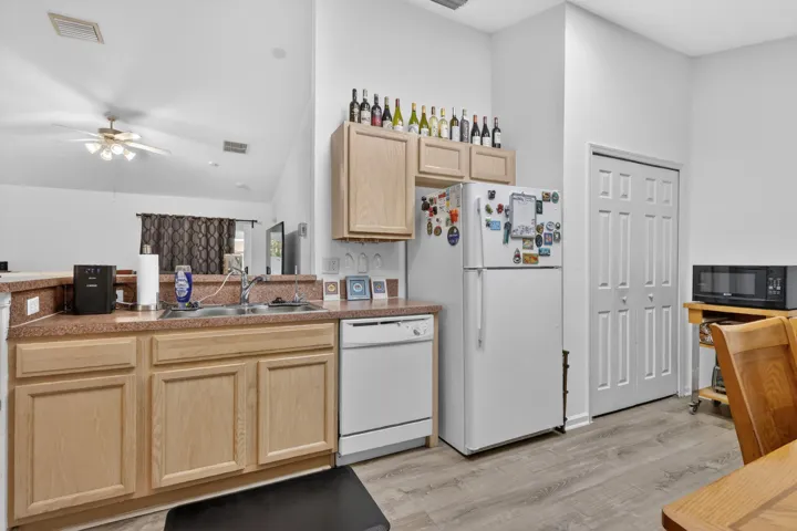 Kitchen facing sink and frig