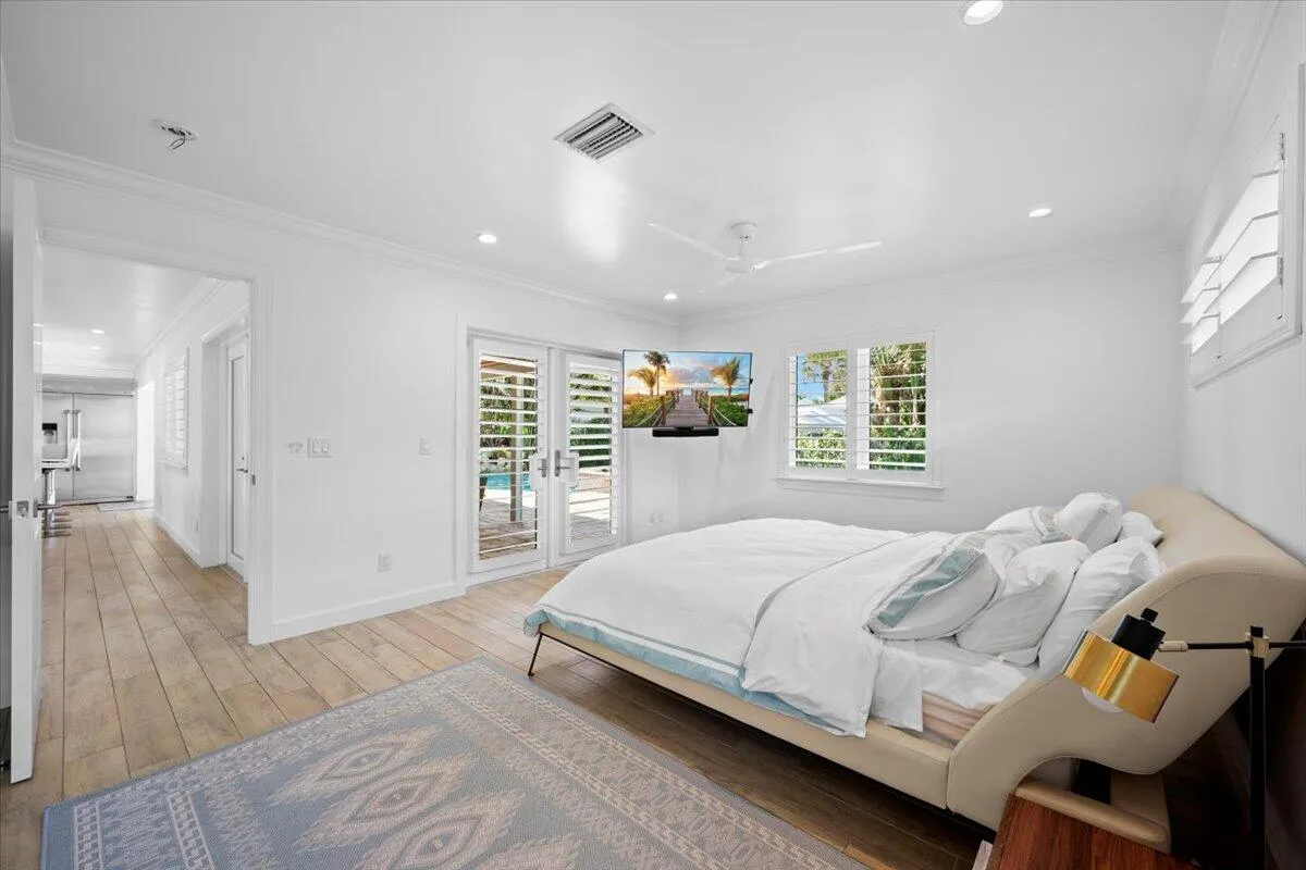 Primary Bedroom with View of Pool