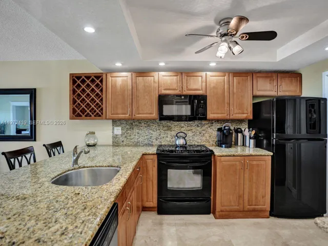 Full size washer in Kitchen behind cabinets