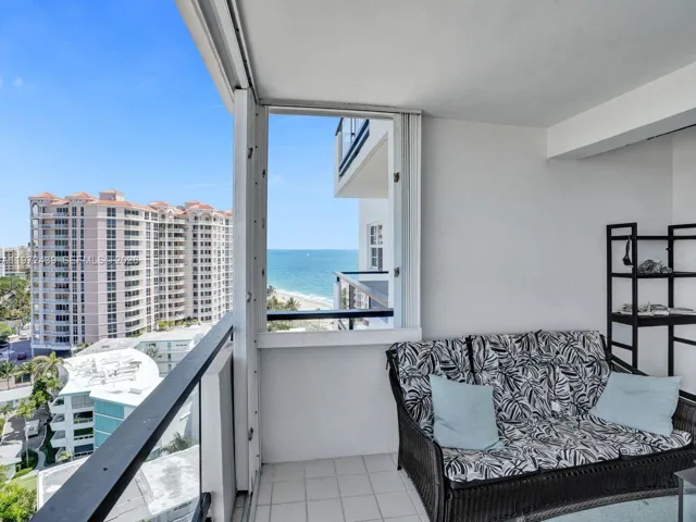 Balcony has full set of accordion shutters so furniture remains during storms