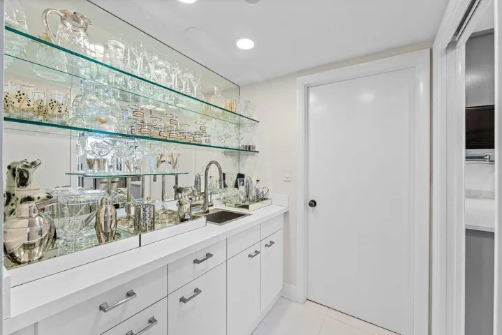 Wet Bar with Laundry Room Beyond