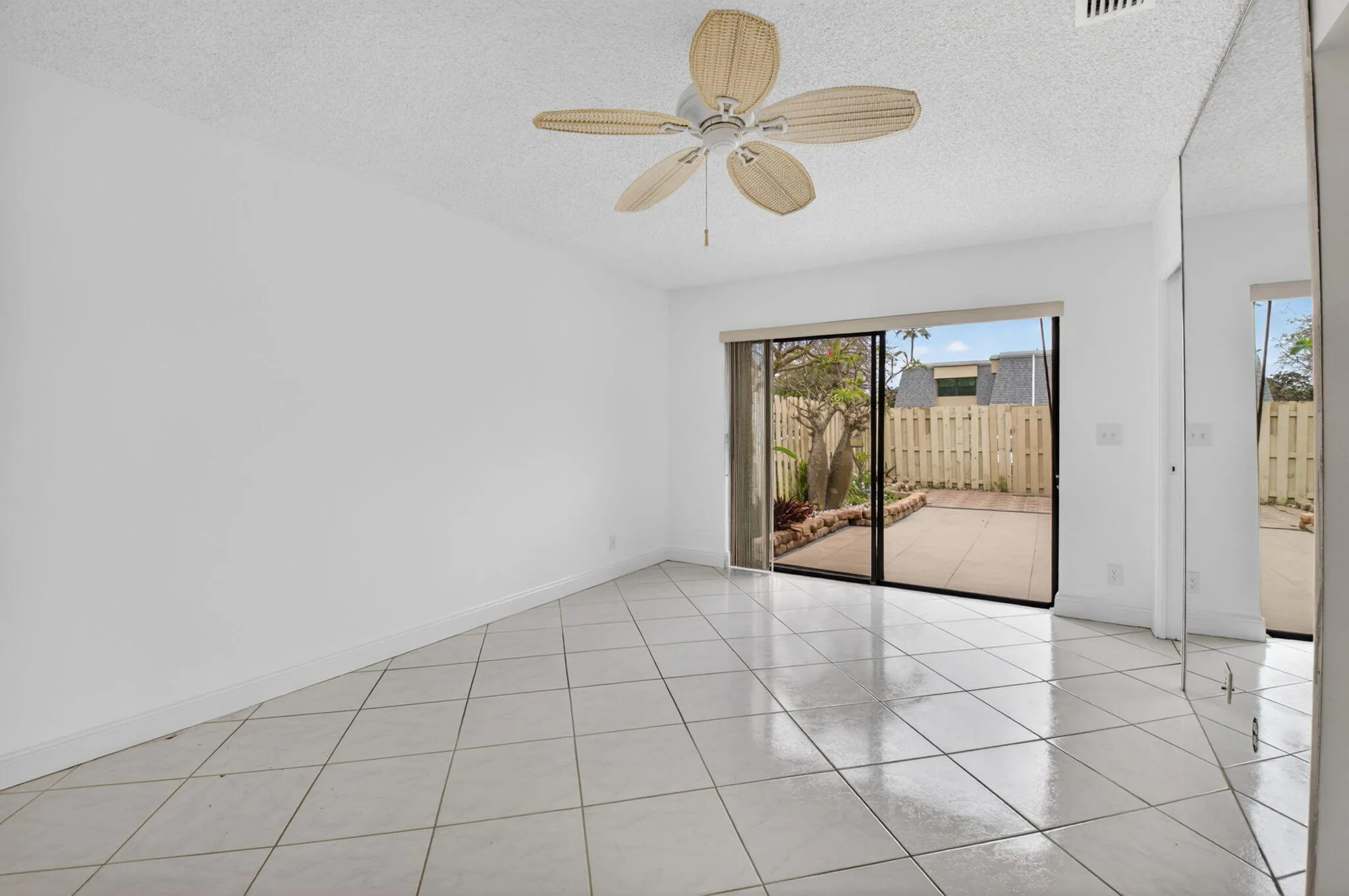 Primary bedroom has sliders that open onto the large courtyard