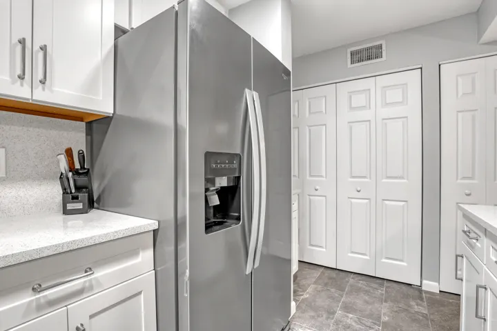A thoughtfully designed kitchen maximizes storage and workflow while remaining open to the main living areas.