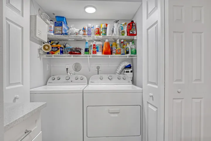 Enjoy the convenience of a full-size washer and dryer with additional storage shelving — everyday practicality built right in.