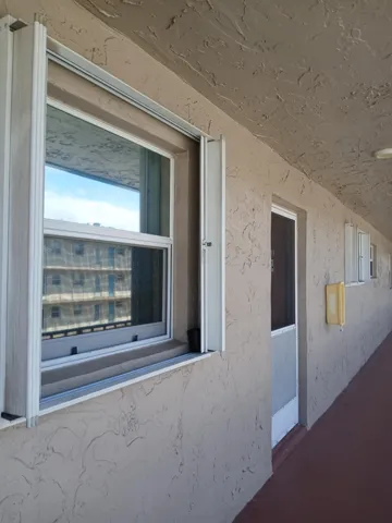 Front door. Impact window w/ hurricane shutter