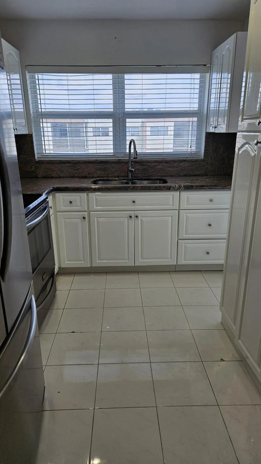 Remodeled kitchen. Double window over sink that brings in lots of sunlight