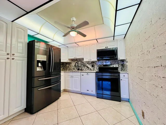 Desirable FIRST FLOOR 2/2 With Water Views In the Luxury Wellington Section of 55+ Century Village!