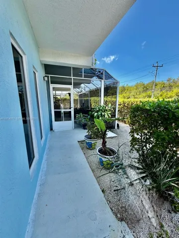 Screened terrace for first floor, entertainment, and relaxing with plants and flowers