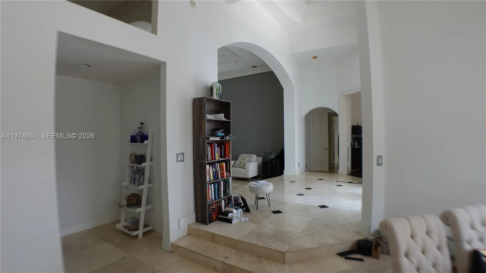 View from the Formal Dining Room towards the Kitchen (1st opening), formal Living Room and beyond to the office and Master Bedroom.