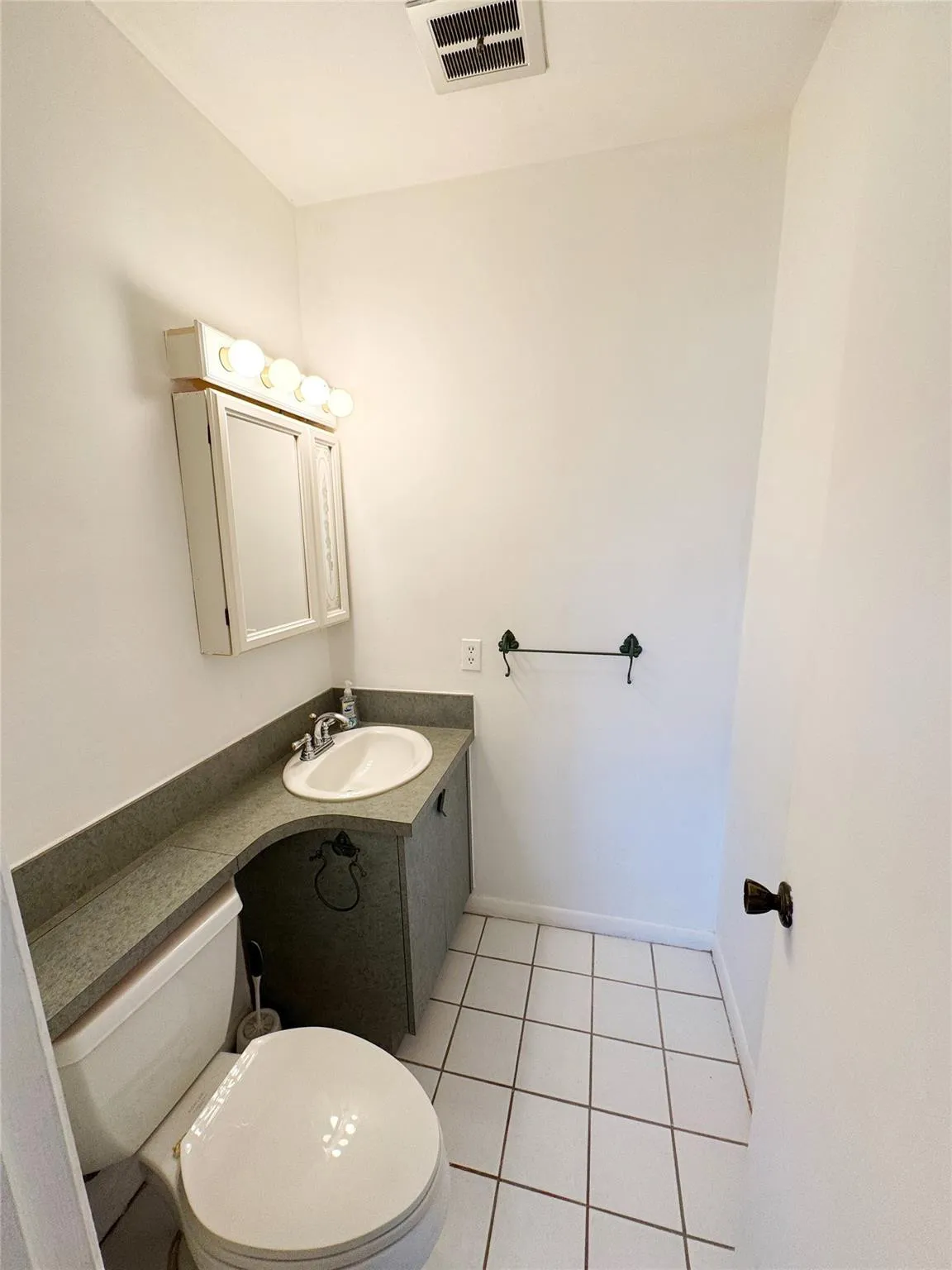 Half bathroom loctaed inside the master bedroom
