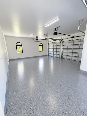 garage will have epoxy floor. AI staged.