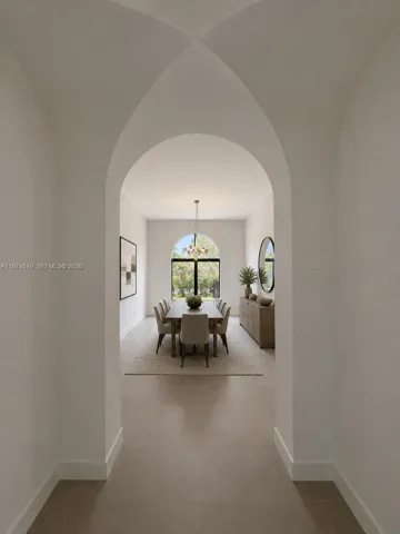 Art passage way from great room to dining room. AI Staged.