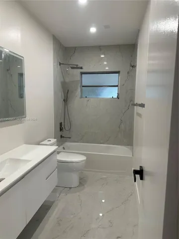 Shared bathroom with tub