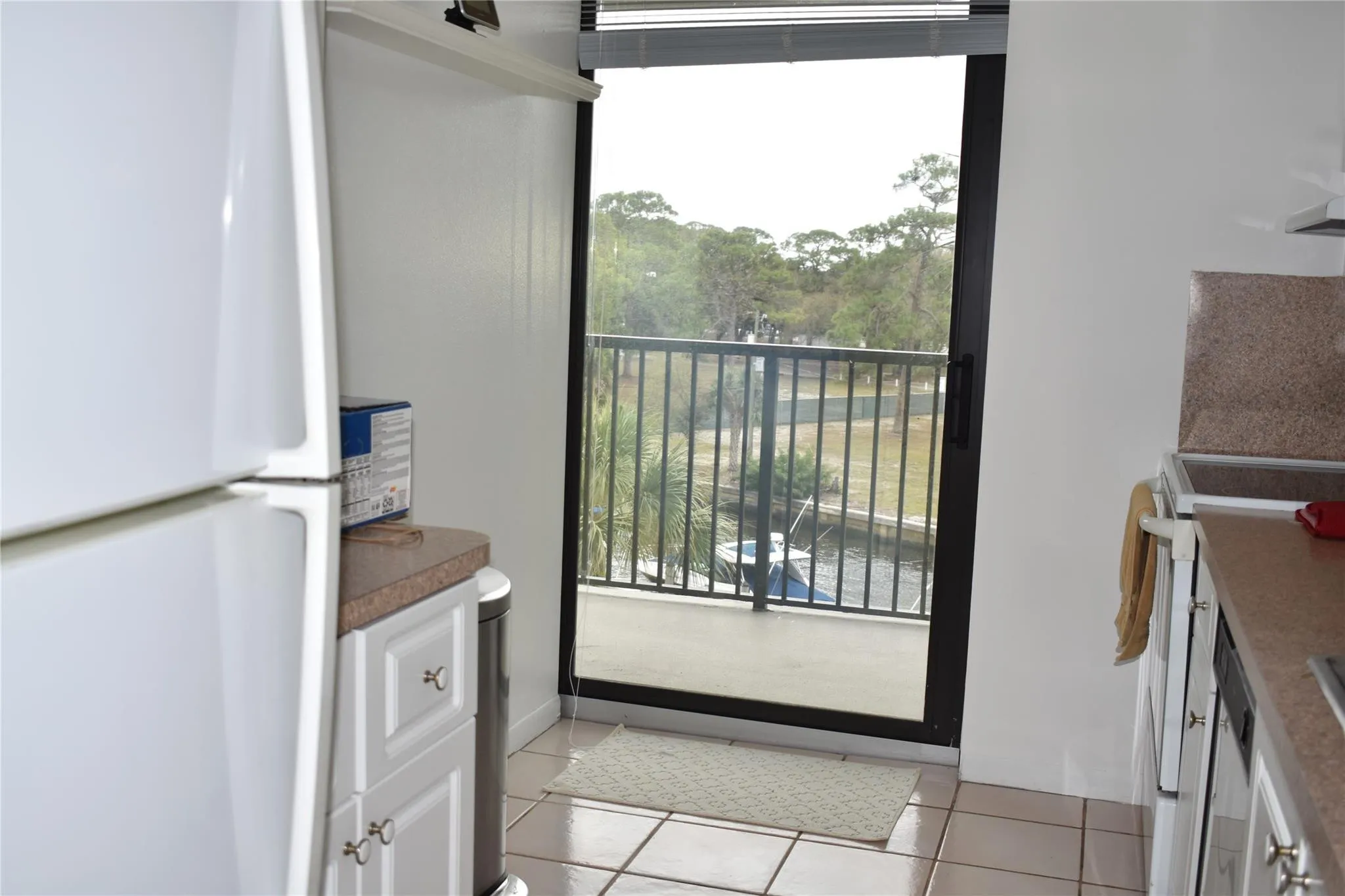 Kitchen with new impact sliding door to balcony
