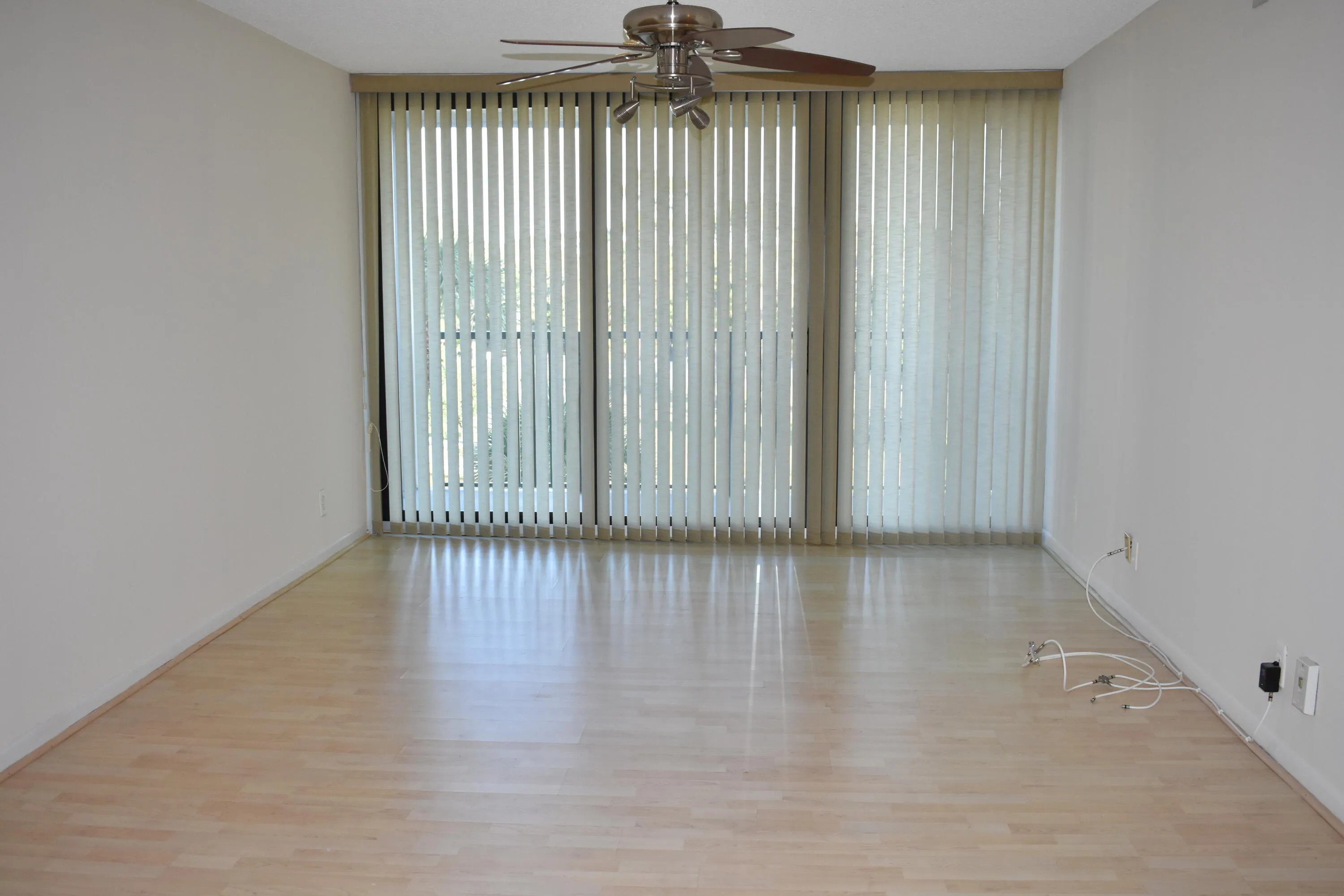 Living Room with no furniture and verticals closed