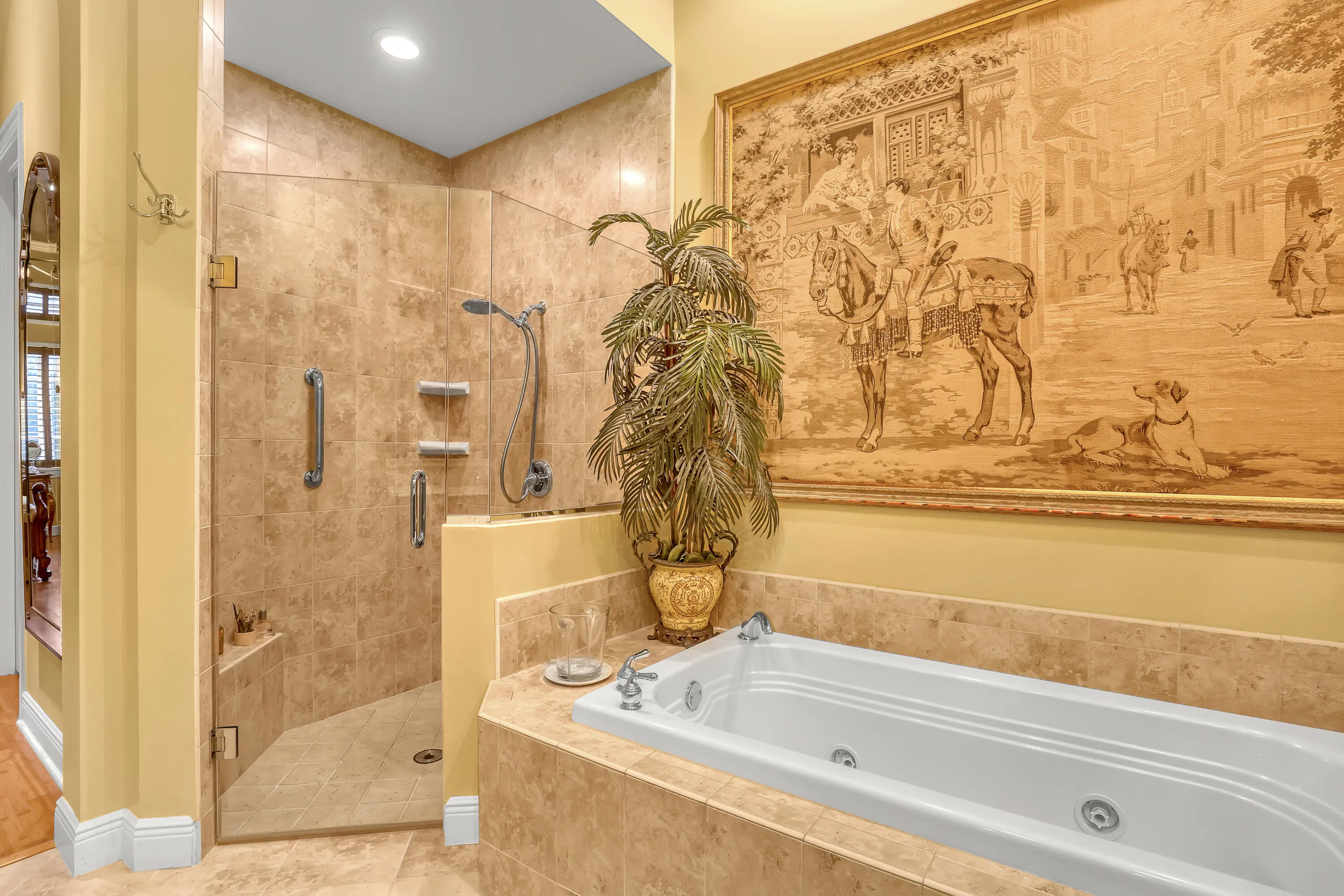 Jacuzzi Roman tub with nearly invisible glass walk in shower