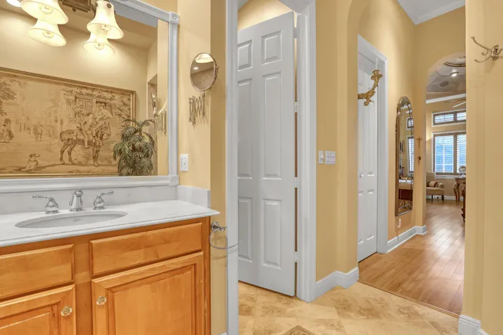 private water closet. Note dual master sinks