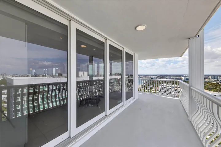 Northern Balcony Area With The Sliding Glass Doors Opened
