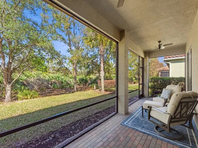 Screened and covered patio right side view.