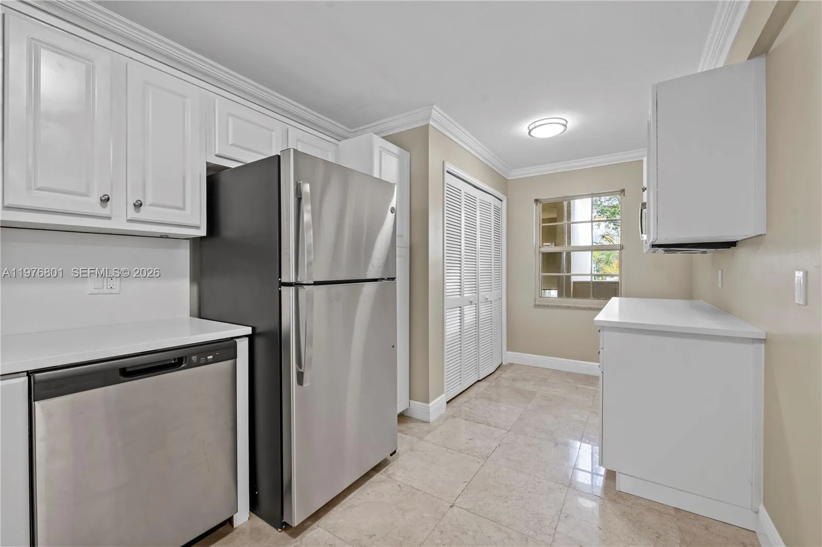 Kitchen with extra storage cabinets and laundry area