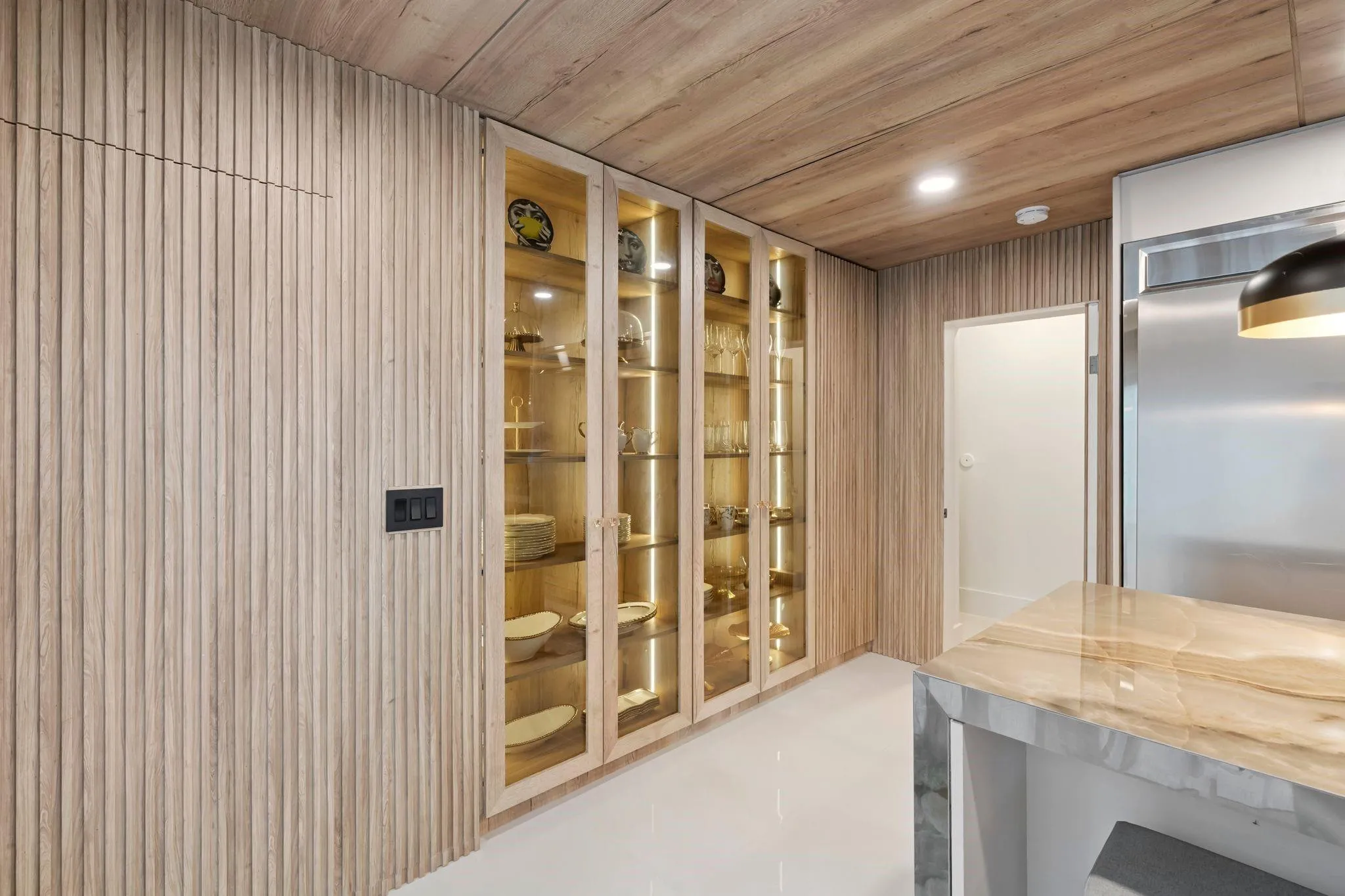 Garage door entry hidden in paneling