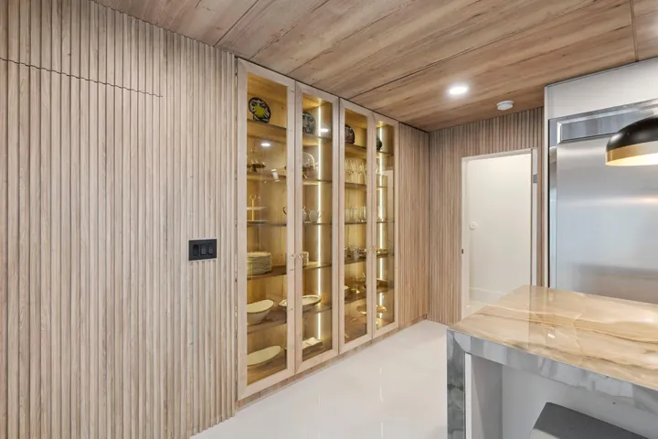 Garage door entry hidden in paneling