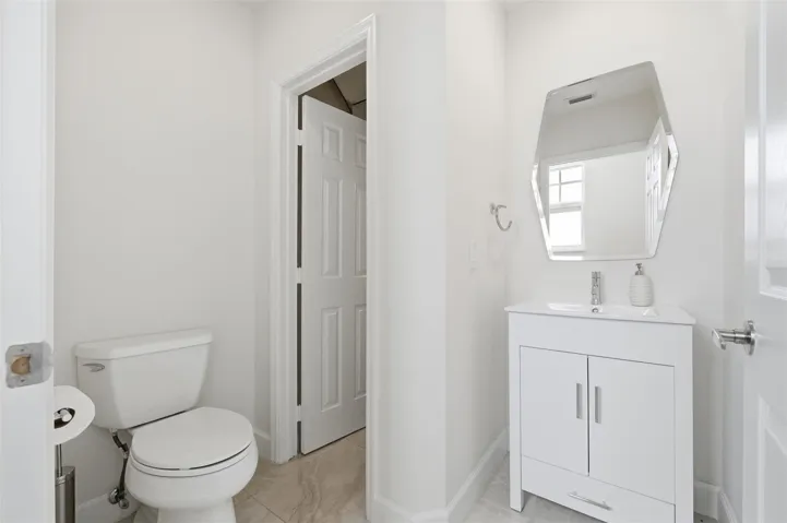 Ground Floor 1/2 bath with under stair storage/pantry