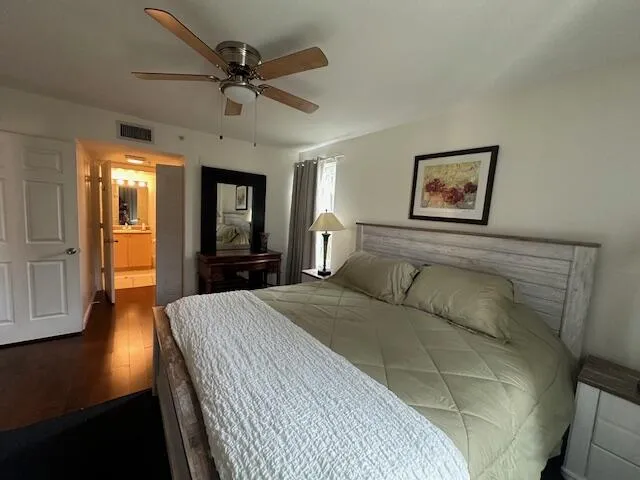 master bedroom -corner unit- lots of natural light-King size bed with TV in Bedroom