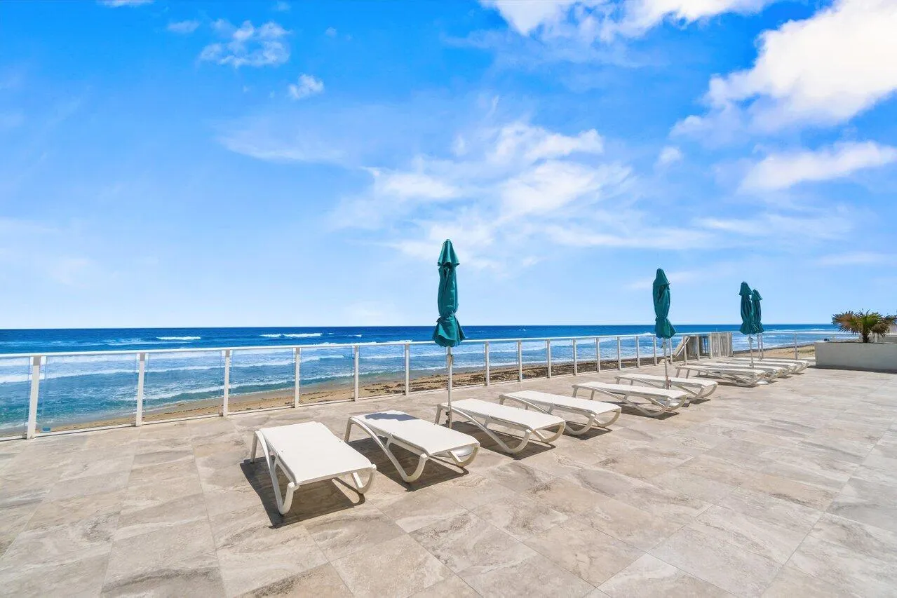 Lots of Lounge Chairs on the Pool DeckOverlooking the Ocean