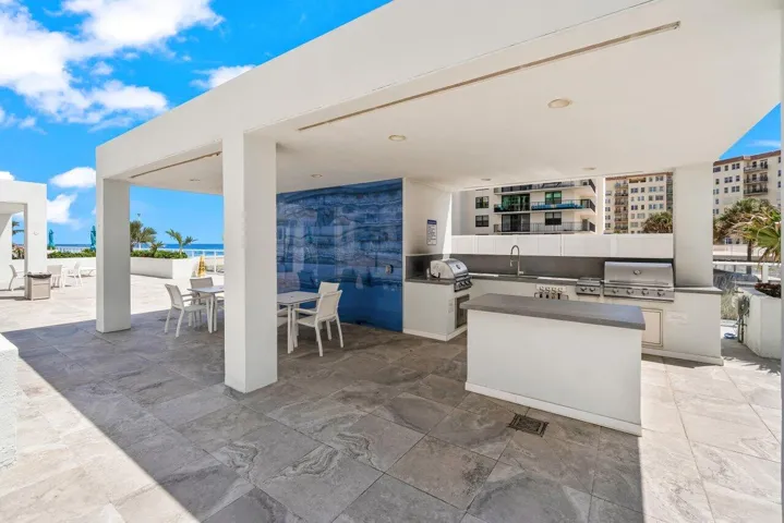 Outdoor Kitchen with BBQ Grills on the Pool DecK