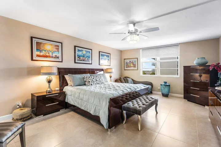 Spacious Primary Suite with Porcelian Tile Floors, a Large Walk-in Closet and an Upgraded Bathroom