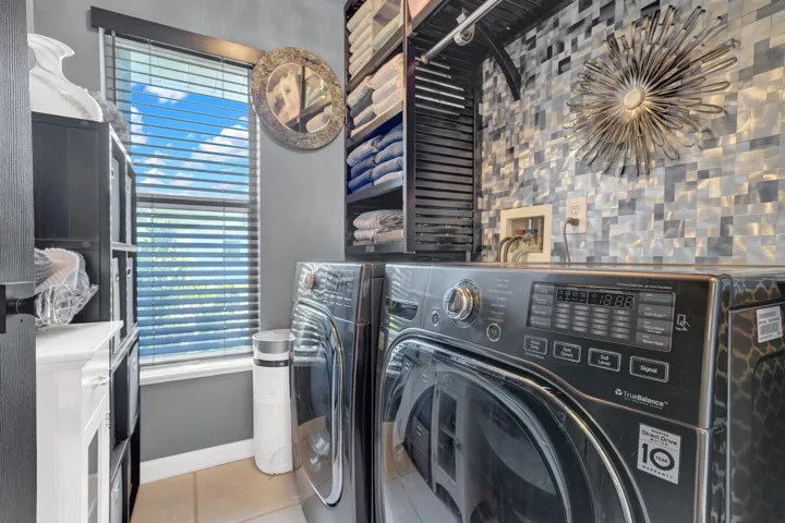 Upgraded Laundry room with John Louis Custom Shelving