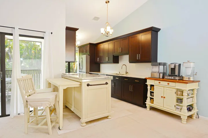 Spectacular redesigned kitchen. All cabinetry and appliances replaced. Seller leaving pull out table with chairs. Stainless steel appliances.