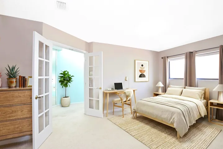Third Bedroom virtually staged. Lovely French doors and lots of natural light. Currently used as an office . Neutral Carpeting.
