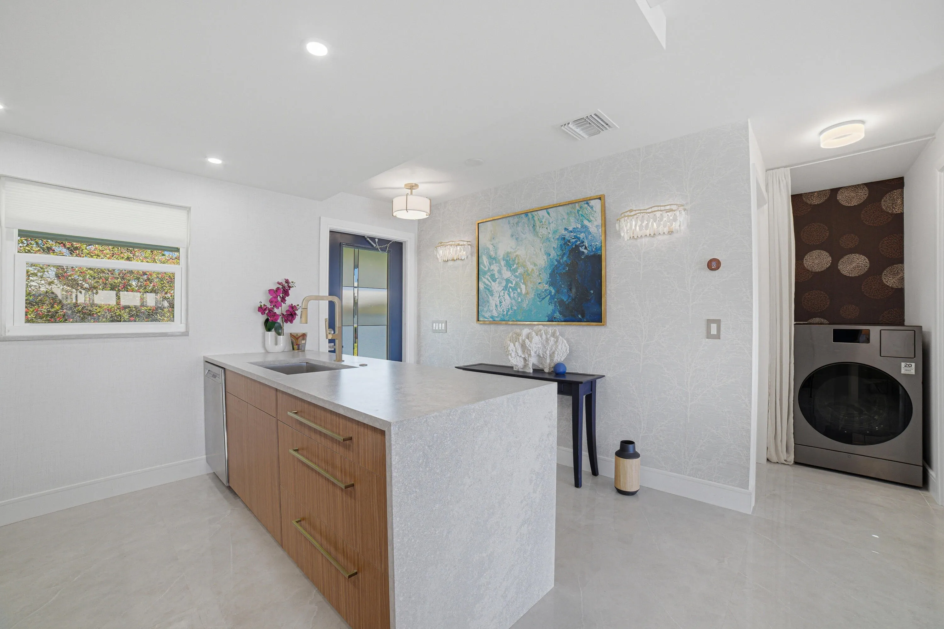 On the right, you’ll see the smart combo washer/dryer. By connecting your phone to this machine, you can instruct it to do your laundry whenever it’s most convenient—even when you’re not at home.
