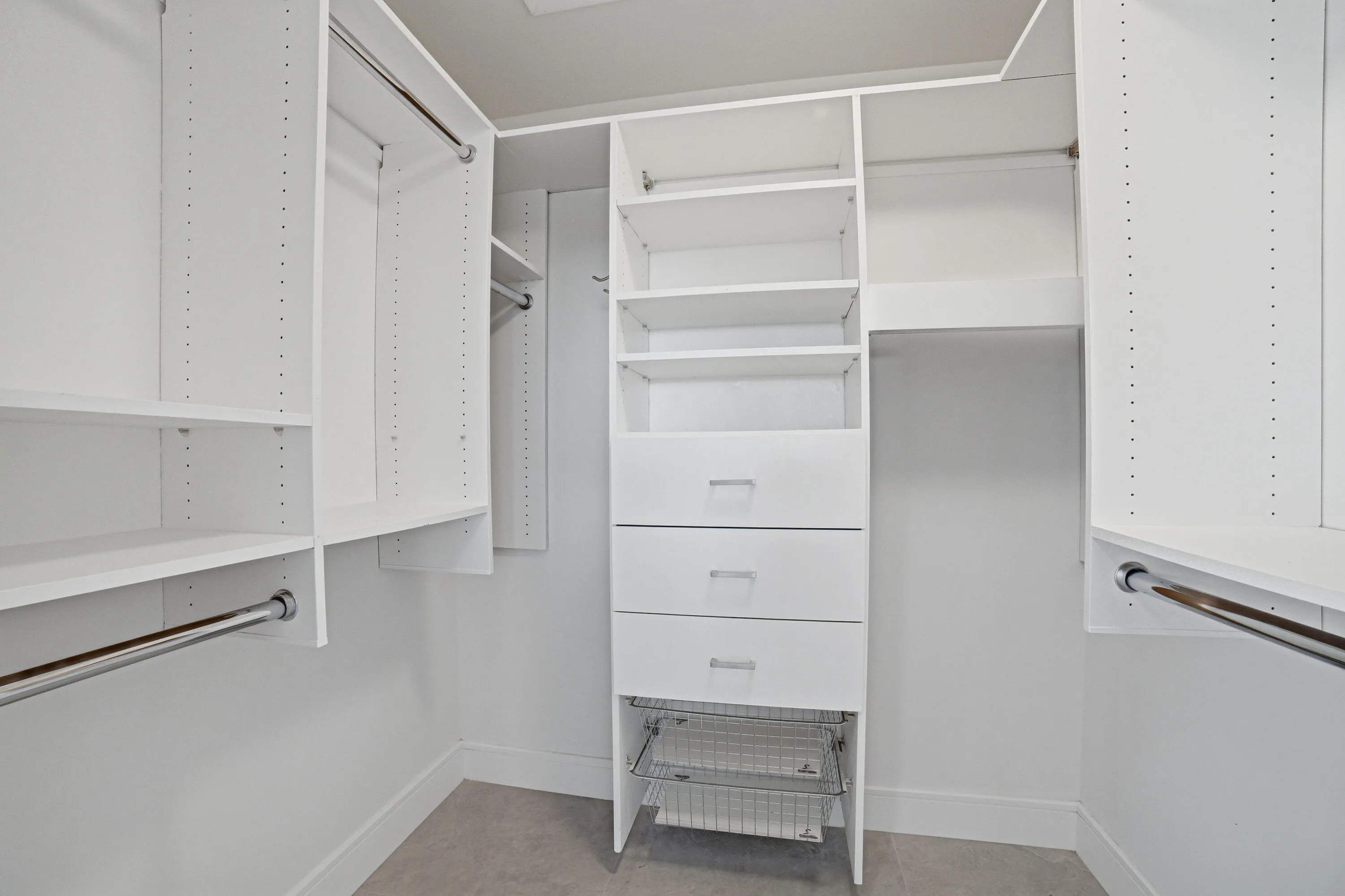 The primary bedroom includes a walk-in closet with built-in organizer, offering efficient storage and organization for personal belongings.
