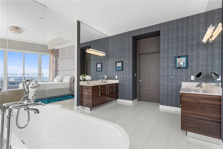 Primary bath with dual vanities and mirrors