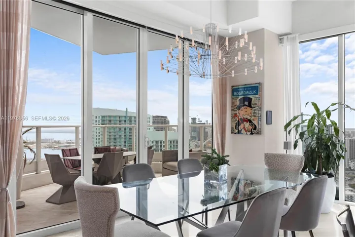 Glass dining table with balcony access