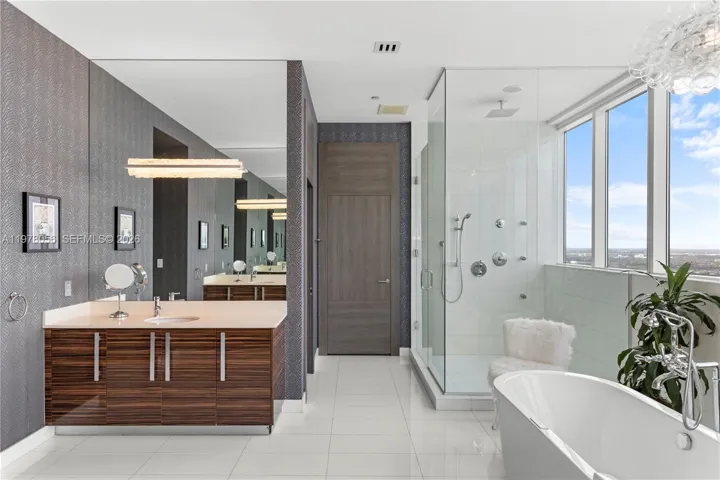 Spacious glass-enclosed rain shower
