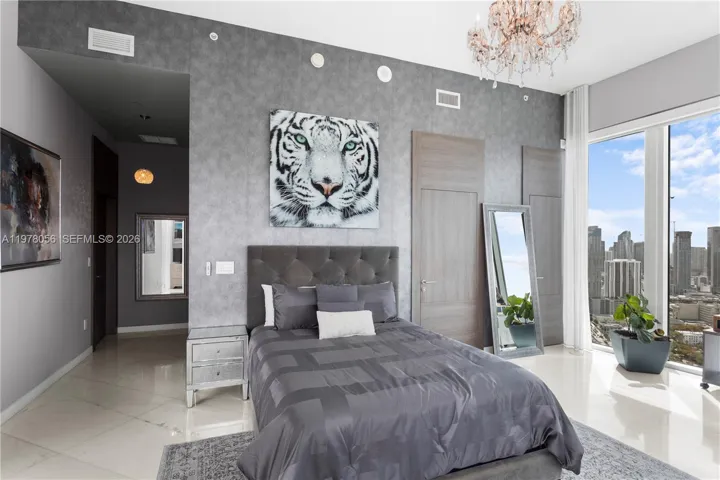 Secondary bedroom with city skyline views. South Views