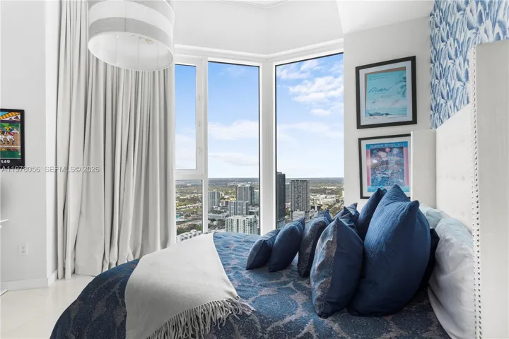 Bright bedroom with floor-to-ceiling windows