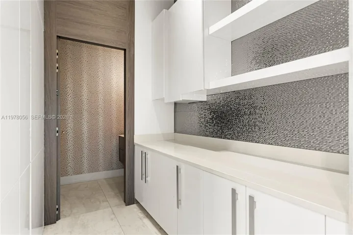 Custom cabinetry and built-in storage area