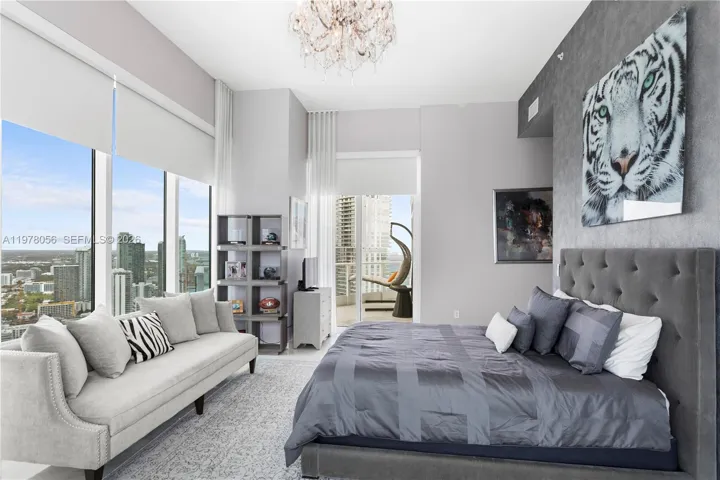 Bedroom with sitting area and skyline views. West and North Views