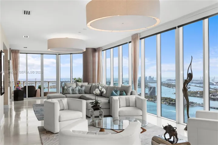 Living area framed by floor-to-ceiling glass