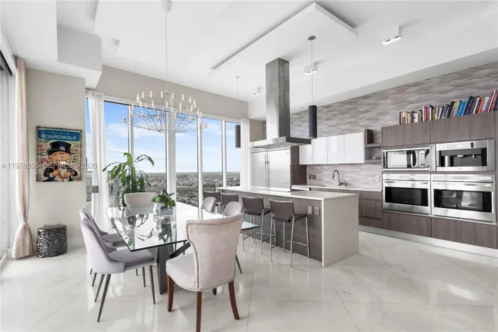 Living area leading to kitchen and dining