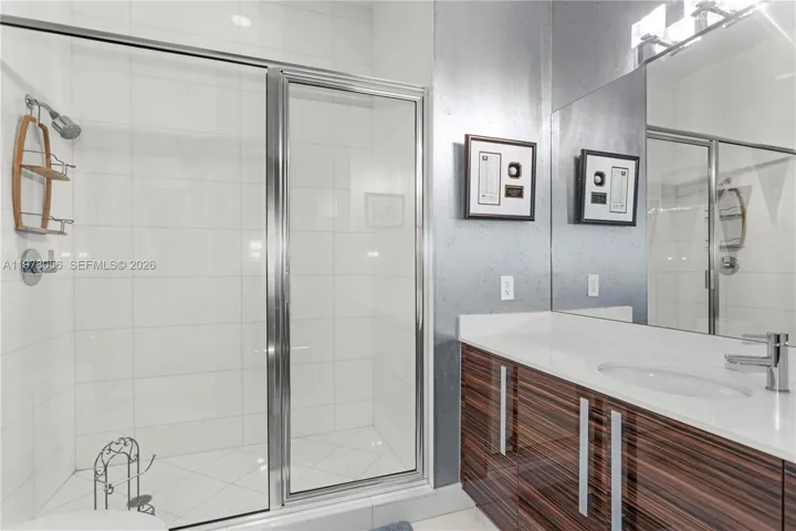 Guest bathroom with glass shower enclosure