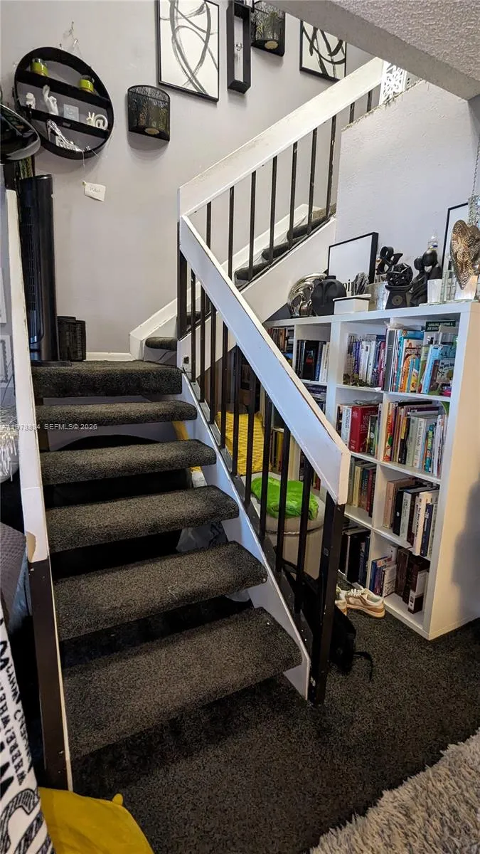 Stairway leading to all three bedrooms and two full bathrooms on the second floor
