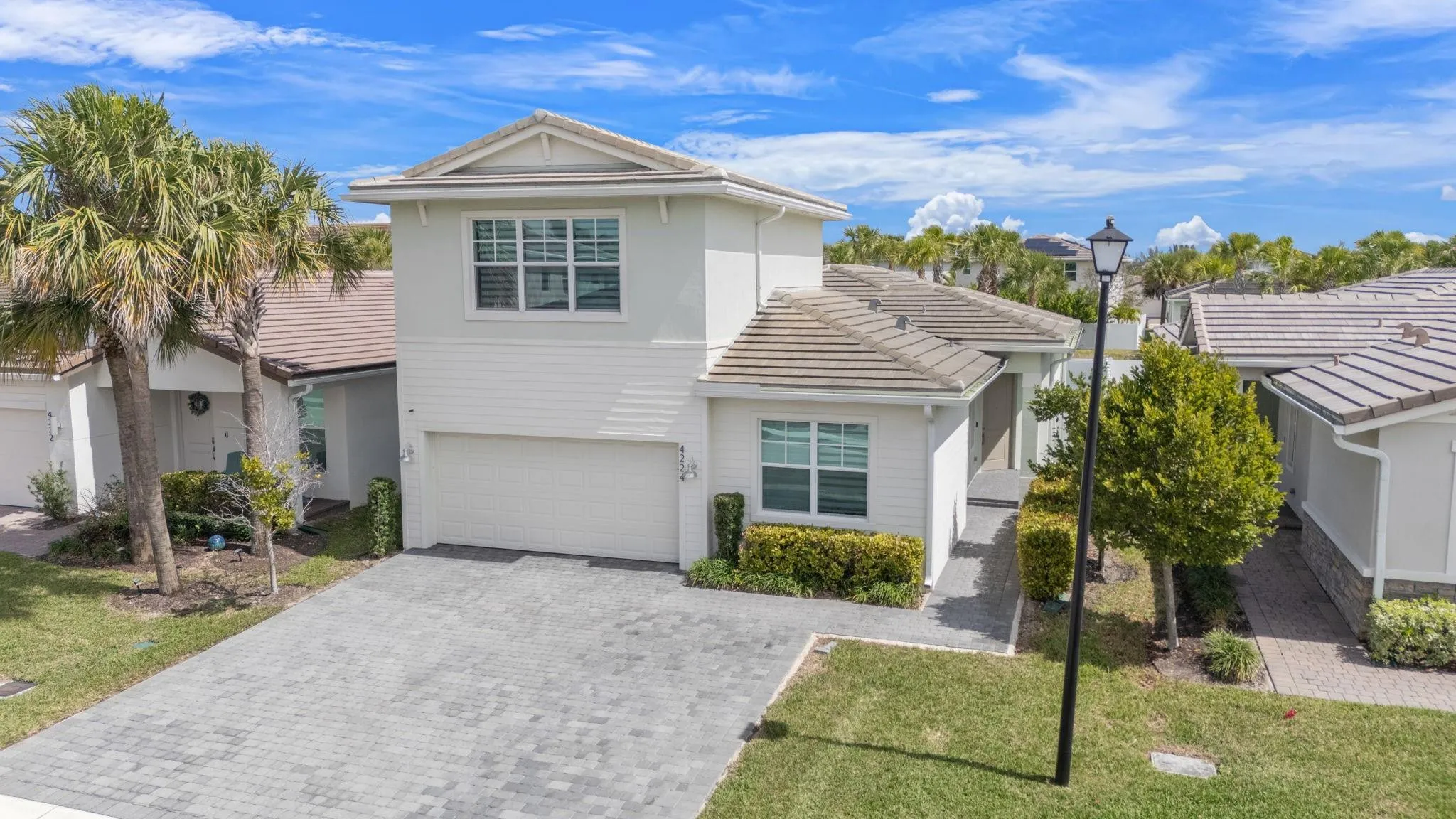 CISNE Model Offers Elegant Modern Architecture with a Set Back Front Entrance. Impact Windows, Doors and Garage Door and a 2021 Roof allows for the Hurricane Protection Insurance Credits.
